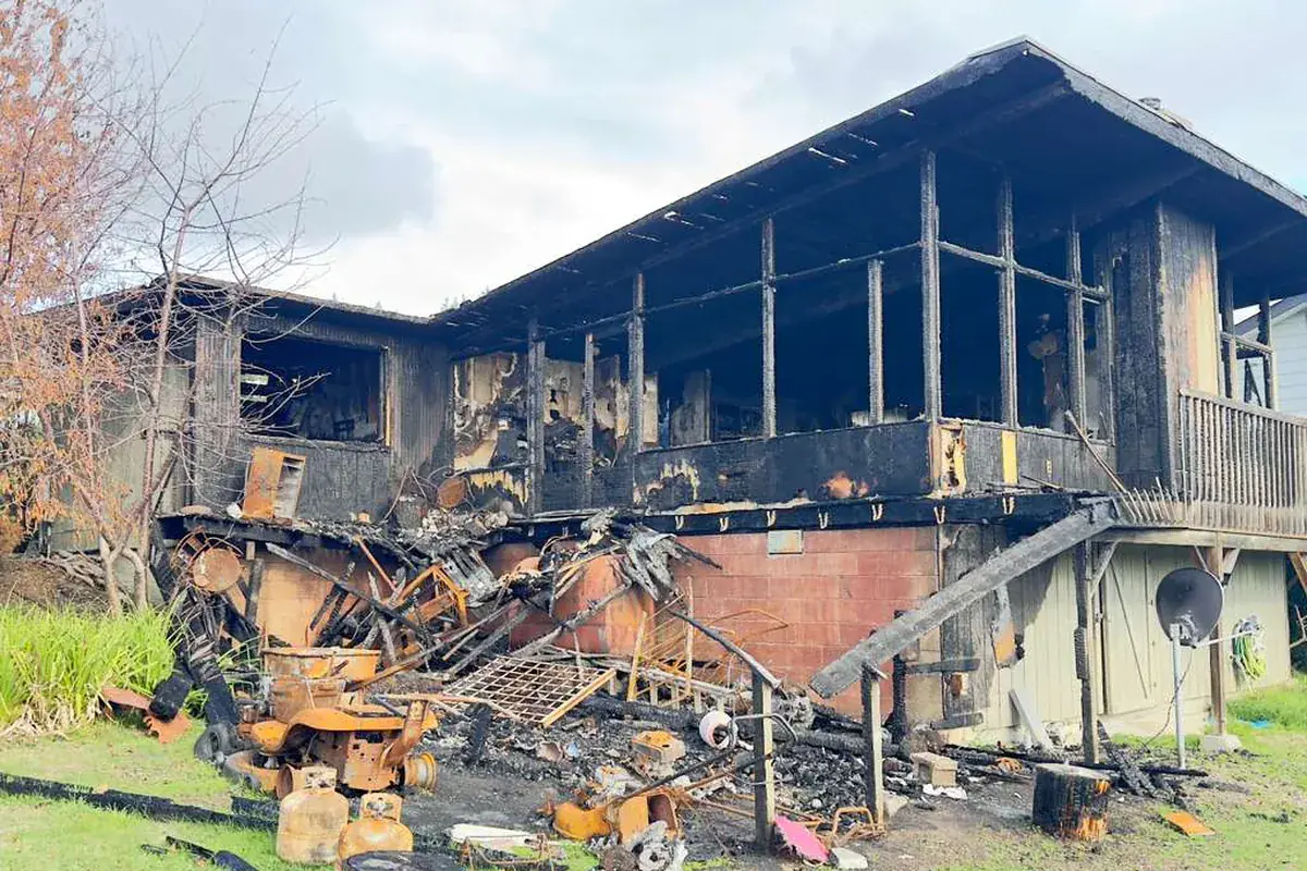 A fire-damaged building ready for demolition and haul-off