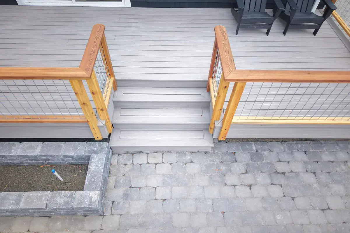 Paver patio, steps, and railing on a completed project
