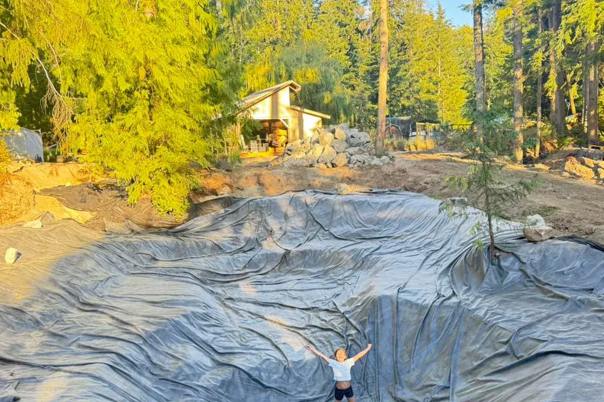 A pond basin excavated and lined on a Whidbey Island property